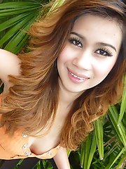 Beautiful Thai teen with red hair shows off her perfect body