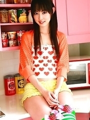 Rina Akiyama Asian in long colorful socks enjoys some sweets